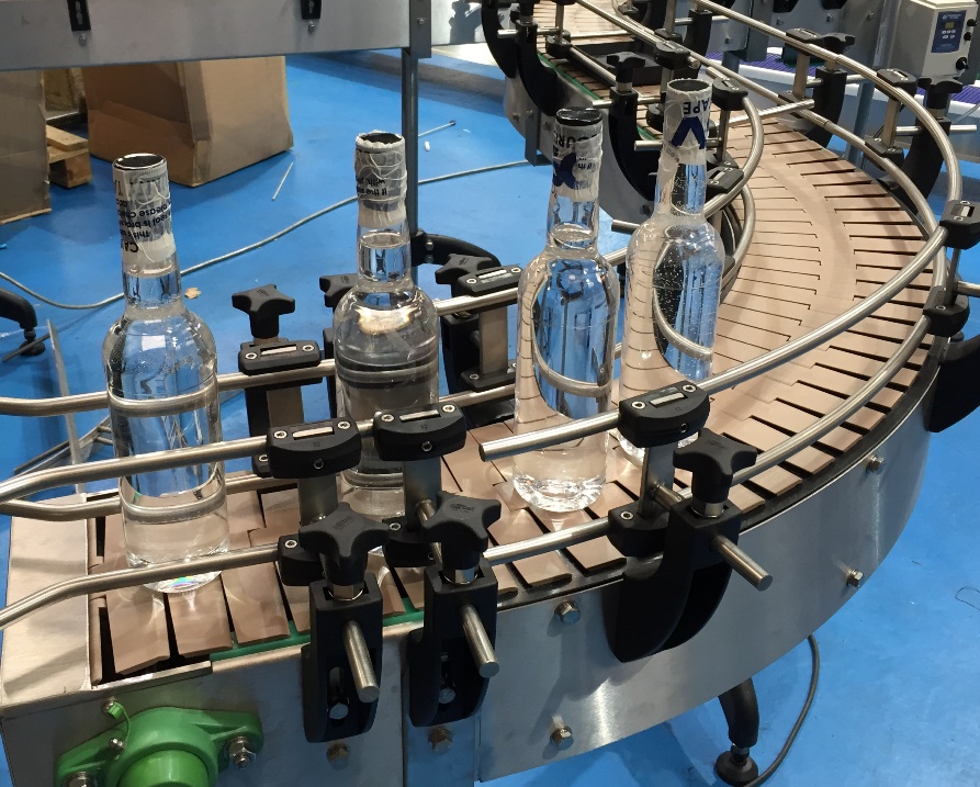 Glass Bottles on Slat Conveyor