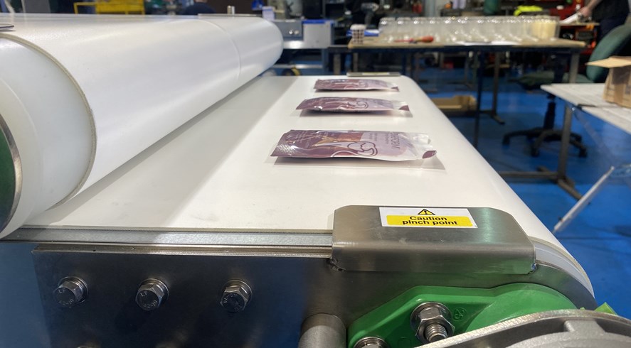 Pouch and Sachet Compression with Conveyors