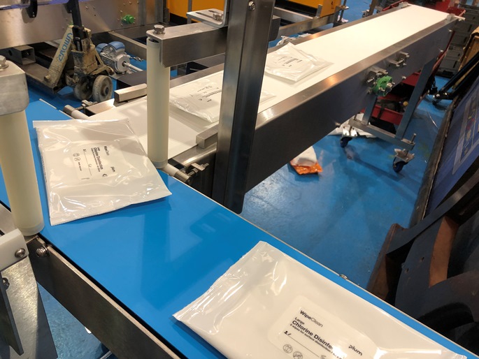 Sterile Wipes on 90 degree conveyor 
